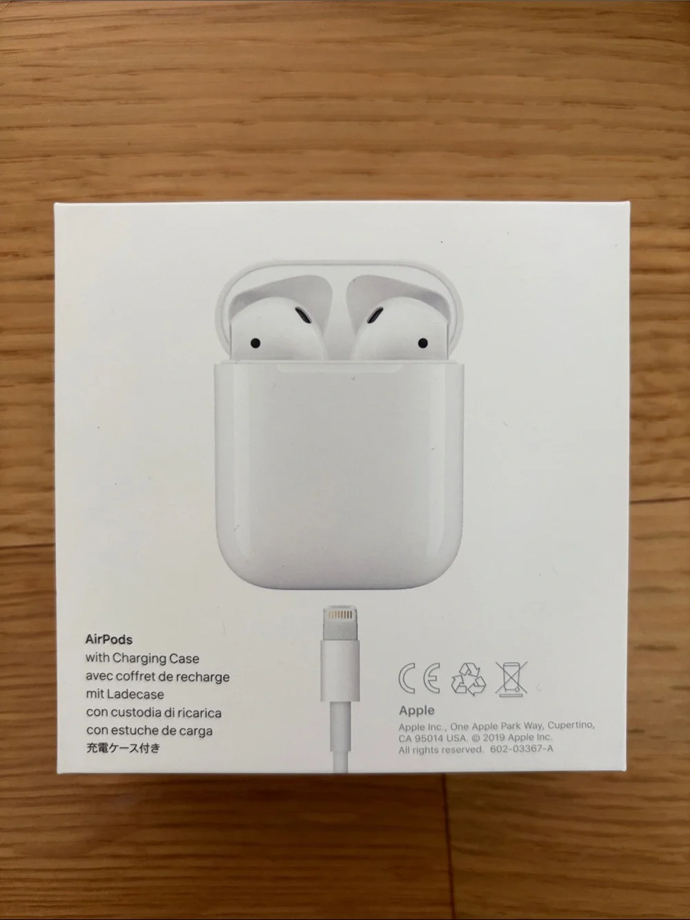 Apple AirPods (2nd gen) with charging case, charging cable, and ThredUp case